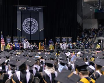 Regent McNulty is introduced at the UCCS spring commencement ceremony