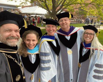 President Saliman (left) with Regents Spiegel, Smith, McNulty, and Rennison at the CU Anschutz Spring 2023 Commencement