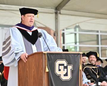 Regent Frank McNulty addresses the Spring 2023 Anschutz graduates