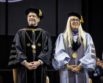 (Left to Right) President Saliman and Regent Rennison smile at the UCCS December 2023 Commencement