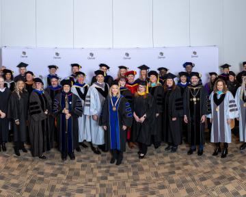 CU Regents pose with the CU Denver Winter 2023 Commencement Stage Party