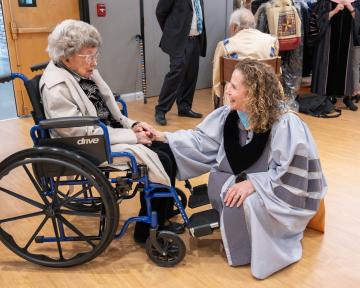 (Left) Peggy Coppom talks with (Right) Regent Ilana Spiegel