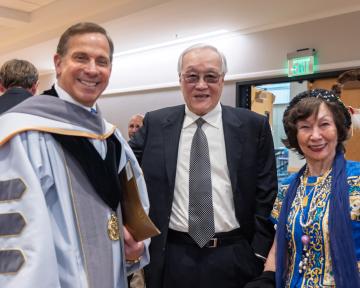 (Left) Regent Ken Montera smiles with (Right) Regent Award Honoree David Chang and his partner