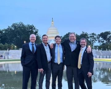 (Left) Regent Mark VanDriel, Regent Ken Montera, Regent Elliott Hood, Regent Ray Scott, and President Todd Saliman pose in front of the Capitol building during the 2025 Colorado Capital Conference